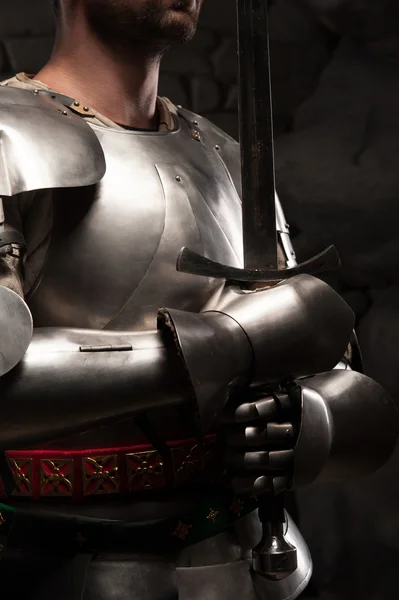 Medieval knight in armor holding a sword — Stock Photo, Image