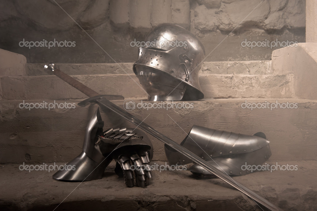 Armor metal gloves, helmet, shoes and sword Stock Photo by ©Dmyrto_Z