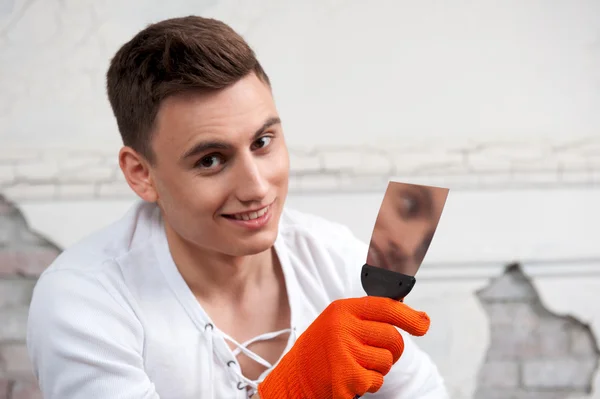 Young handsome man with spatula — Stock Photo, Image