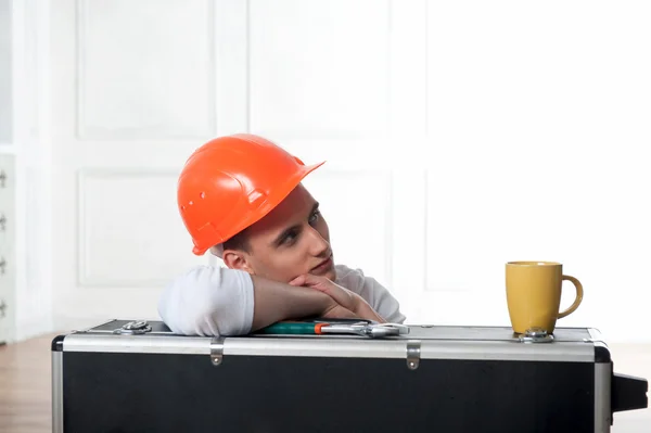 Worker in helmet with coffee cup — Stock Photo, Image