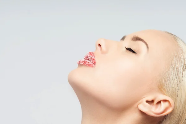 Portrait of sexual beautiful blonde with lips sprinkled sugar is — Stock Photo, Image