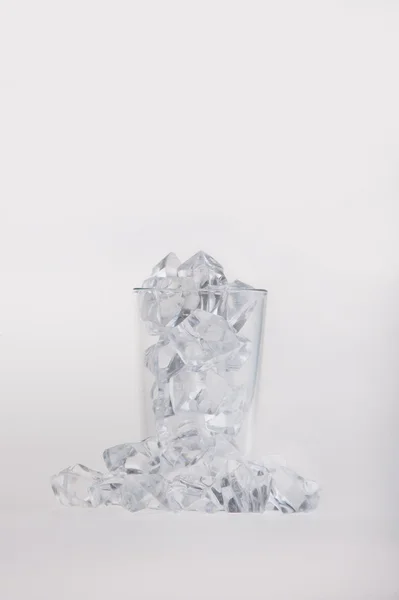 Empty glass filled with ice cubes — Stock Photo, Image