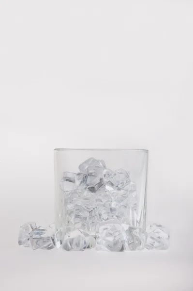 Empty glass filled with ice cubes — Stock Photo, Image