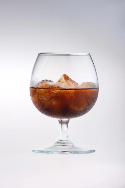 Glass being filled with cola — Stock Photo, Image