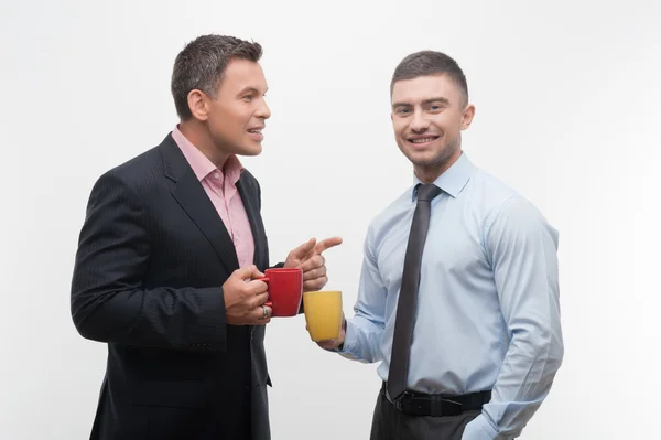 Business people discuss something during coffee break — Stock Photo, Image