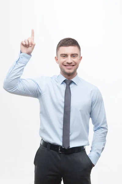 Junior handsome manager showing process of idea search — Stock Photo, Image