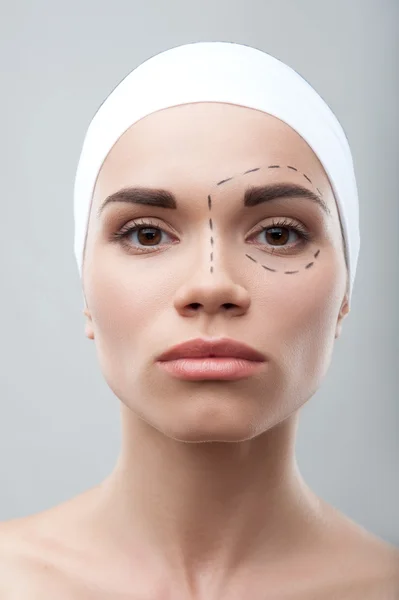 Beautiful young woman with perforation lines on her face before — Stock Photo, Image