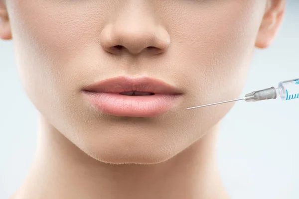 Beautiful woman gets injection in her face — Stock Photo, Image