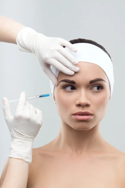 Caucasian woman getting cosmetic injection — Stock Photo, Image