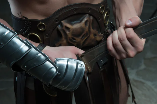 Closeup of gladiator holding sword — Stock Photo, Image