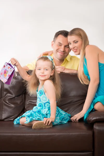 Cute little girl having fun with presents — Stock Photo, Image