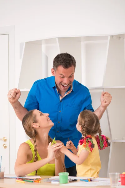 Lovely happy family drawing and painting at home together — Stock Photo, Image