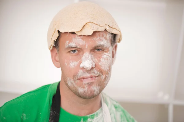 Funny handsome man with dough — Stock Photo, Image