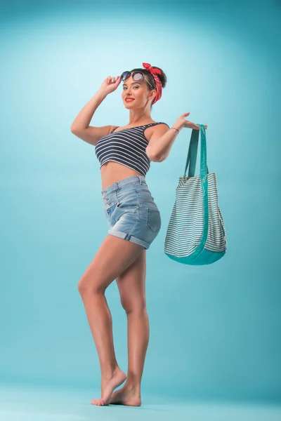Beautiful girl in pinup style with inflatable — Stock Photo, Image