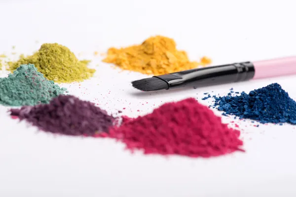 Close-up view of  professional make-up brush surrounded by heaps — Stock Photo, Image