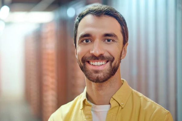 Cheerful smiling man in utility room