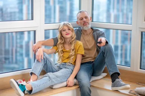 A gray-haired mature man and his daughter feeling good together — Stock Photo, Image