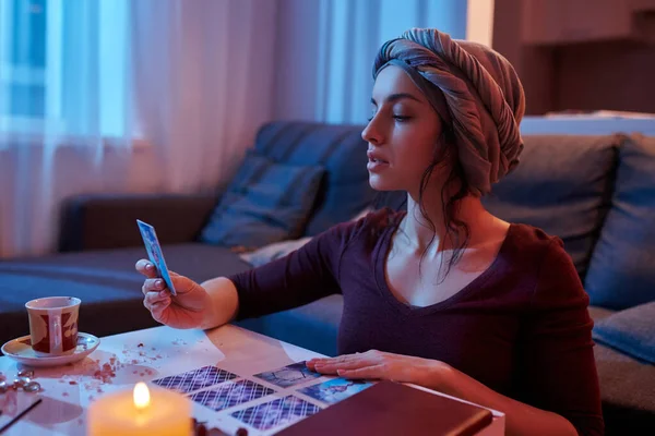 Female soothsayer concentrated on Tarot card reading — Stock Photo, Image