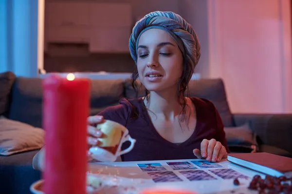 Young female soothsayer trying to predict future — Stock Photo, Image
