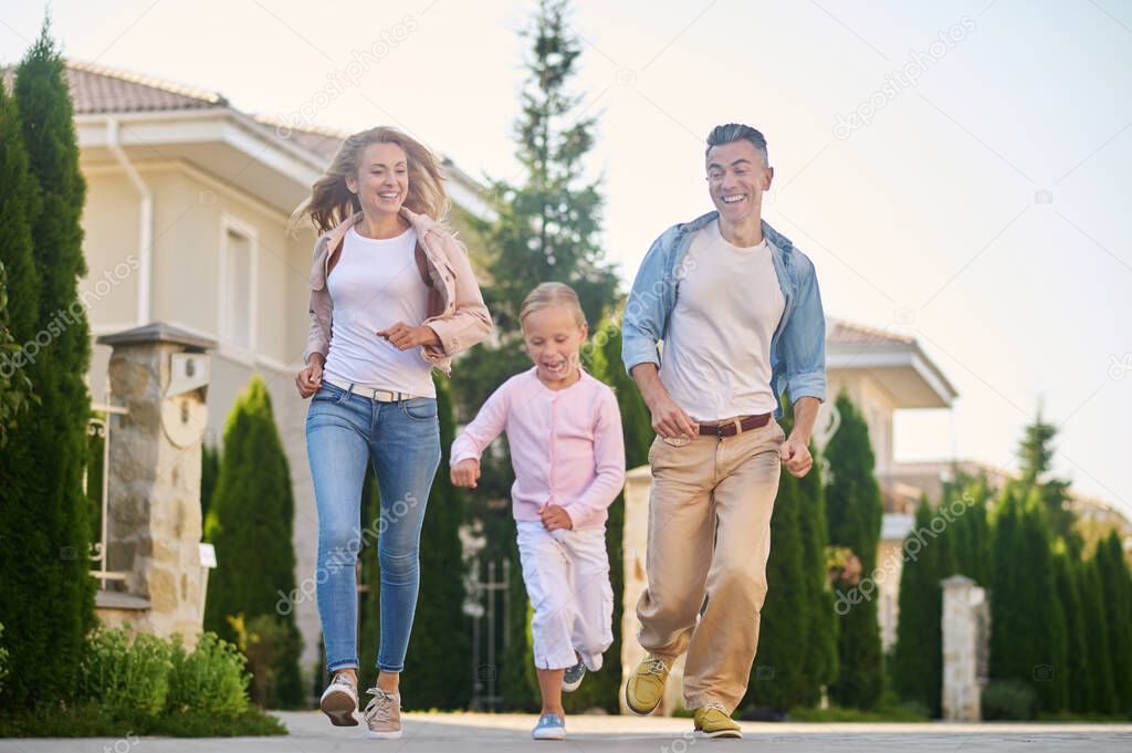Young family having a walk and enjoying