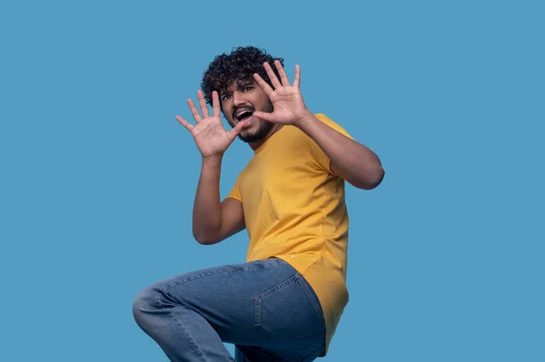 Scared young man showing the Stop gesture — 图库照片