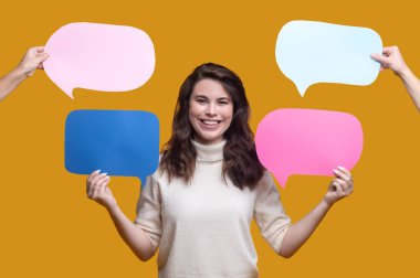 Smiling female demonstrating empty question and answer signs