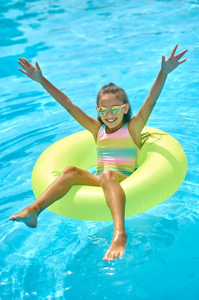 Top view of girl on inflatable ring on water — Stock Photo, Image
