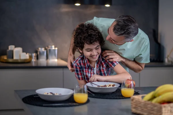 Man talking with his son in playful mood — Stock Photo, Image