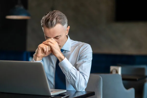 A businessman feeling tired after long work — Stock Photo, Image