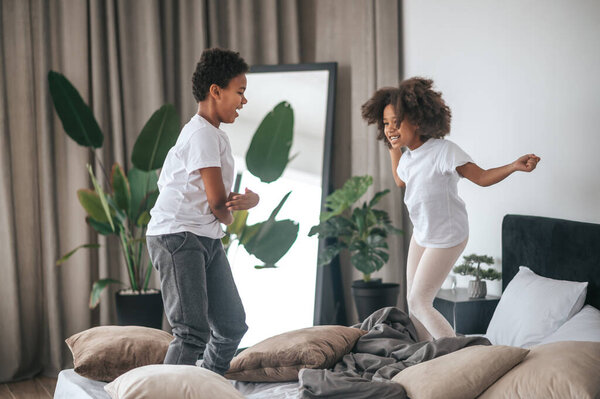 Two siblings playing together and having fun