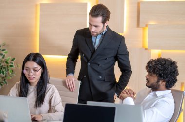 Team of company employees in the meeting room