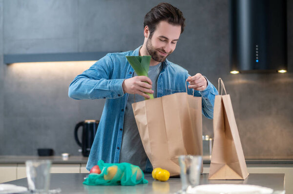 Interesting Here Smiling Young Bearded Man Standing Peeking Bag Taking Stock Picture