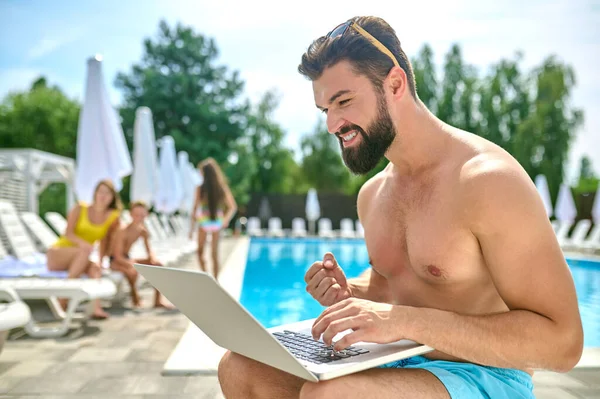 Focused Excited Bearded Dark Haired Young Man Sitting Swimming Pool — Stock Photo, Image