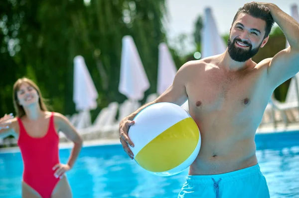 Smiling Pleased Handsome Male Game Ball Standing Water Woman — Stock Photo, Image