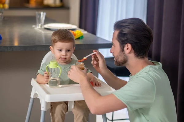 Breakfast Babyboy Young Father Feeding His Cute Baby Son Looking — Stock Photo, Image