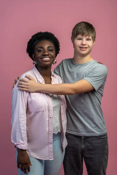 Good Moments Happy Caucasian Guy Syndrome Hugging African American Woman — Stockfoto