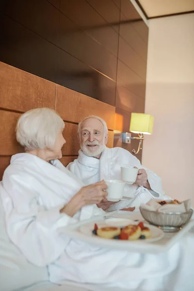 Wonderful Breakfast Senior Happy Couple Enjoying Breakfast While Staying Bed — Foto de Stock