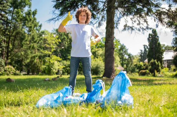 Good Job Confident Teen Standing Bags Full Garbage — Foto Stock