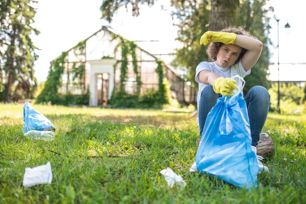 Tired Cute Young Volunteer Looking Tired Gathering Garbage — Stok Foto