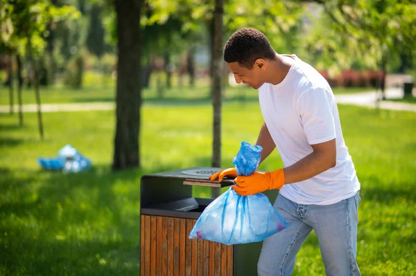 Cleanliness Environment Young Dark Skinned Man Gloves Holding Garbage Bags —  Fotos de Stock