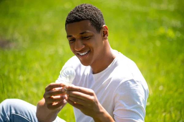 Ecological Issues Young Dark Skinned Smiling Man Looking Interestedly Light — Foto de Stock