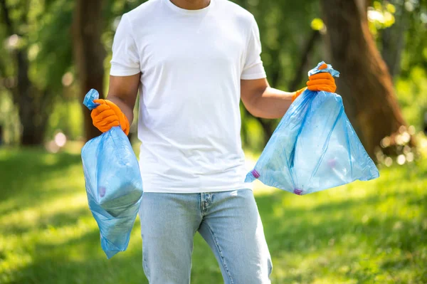 Ecological Issues Dark Skinned Man Gloves Holding Garbage Bags Standing — стоковое фото