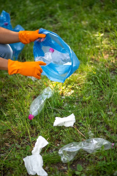 Caring Nature Hands Gloves Putting Plastic Garbage Bag Background Green — Fotografia de Stock