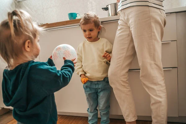 Little Girl Her Cute Sister Playing Balloon While Parent Cooking —  Fotos de Stock
