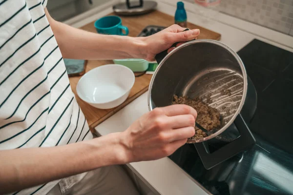 Cropped Photo Woman Stirring Porridge Pot Metal Spoon — Stok fotoğraf