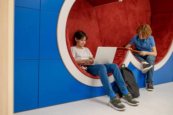 Doing Homework Two School Boys Feeling Comfortable Lounge Zone Doing — Stok fotoğraf