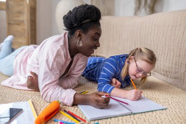 Lesson. A cute girl writing something and looking involved