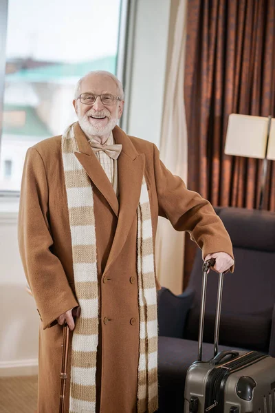 Arrival Elegant Gray Haired Man Brown Coat Standing Hotel Room — Stok fotoğraf