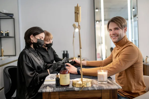 Hands Care Fair Haired Man Sitting Salon Having Manicure — Foto de Stock