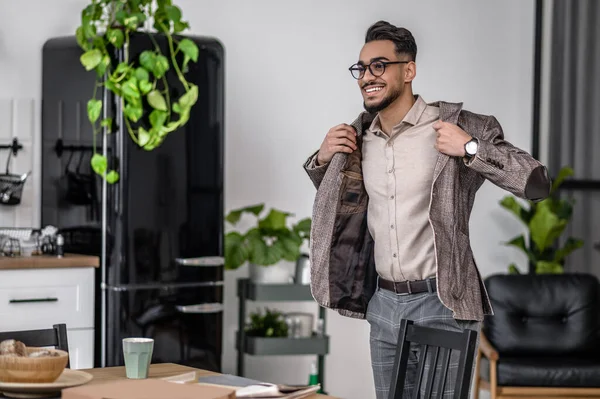 Wellbeing Young Bearded Elegant Man Putting Jacket Smiling Side Standing — Stockfoto